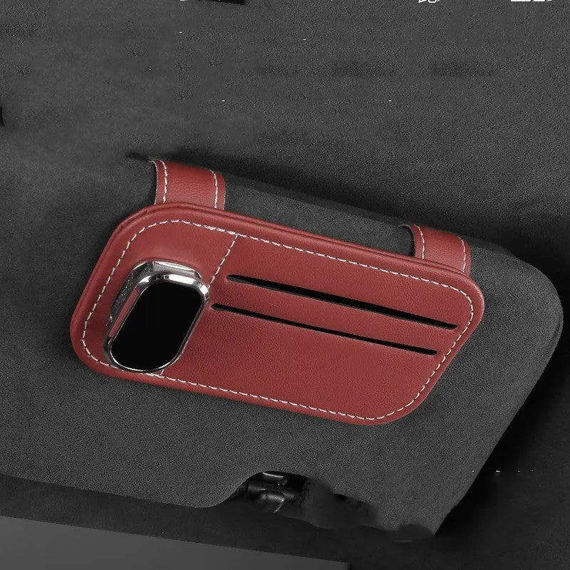 Cowhide leather card holder clipped onto a car sun visor in a choice of colours.