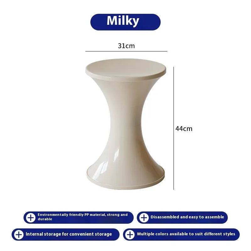 Plastic hourglass-shaped shoe changing stool shown in available colours.