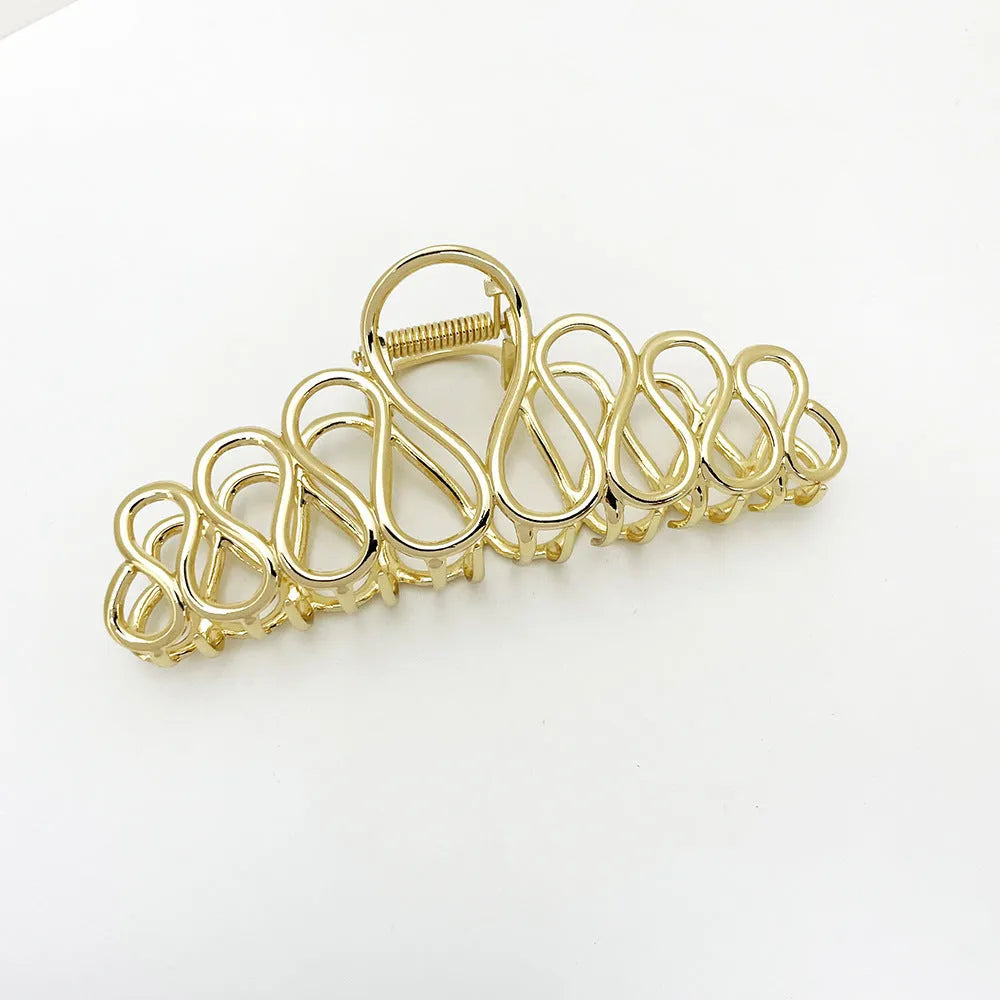 Large minimalist updo hair clip in gold or silver electroplated alloy with tassel details