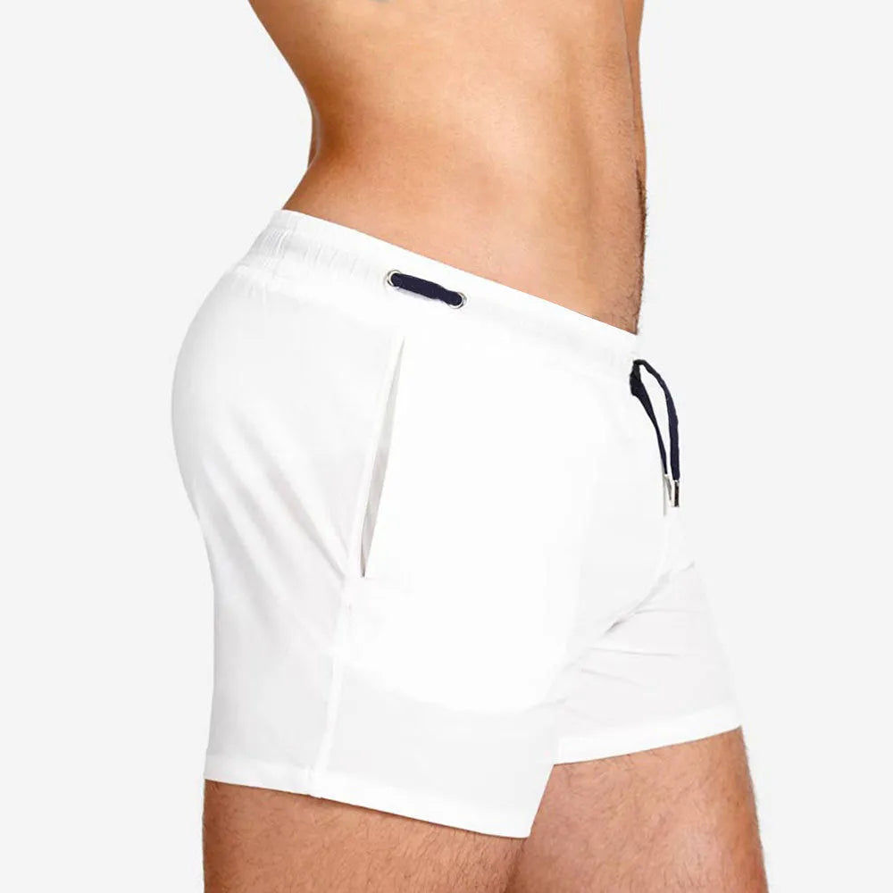 Polyester sports shorts with mesh lining in Army Green colour on a white background.