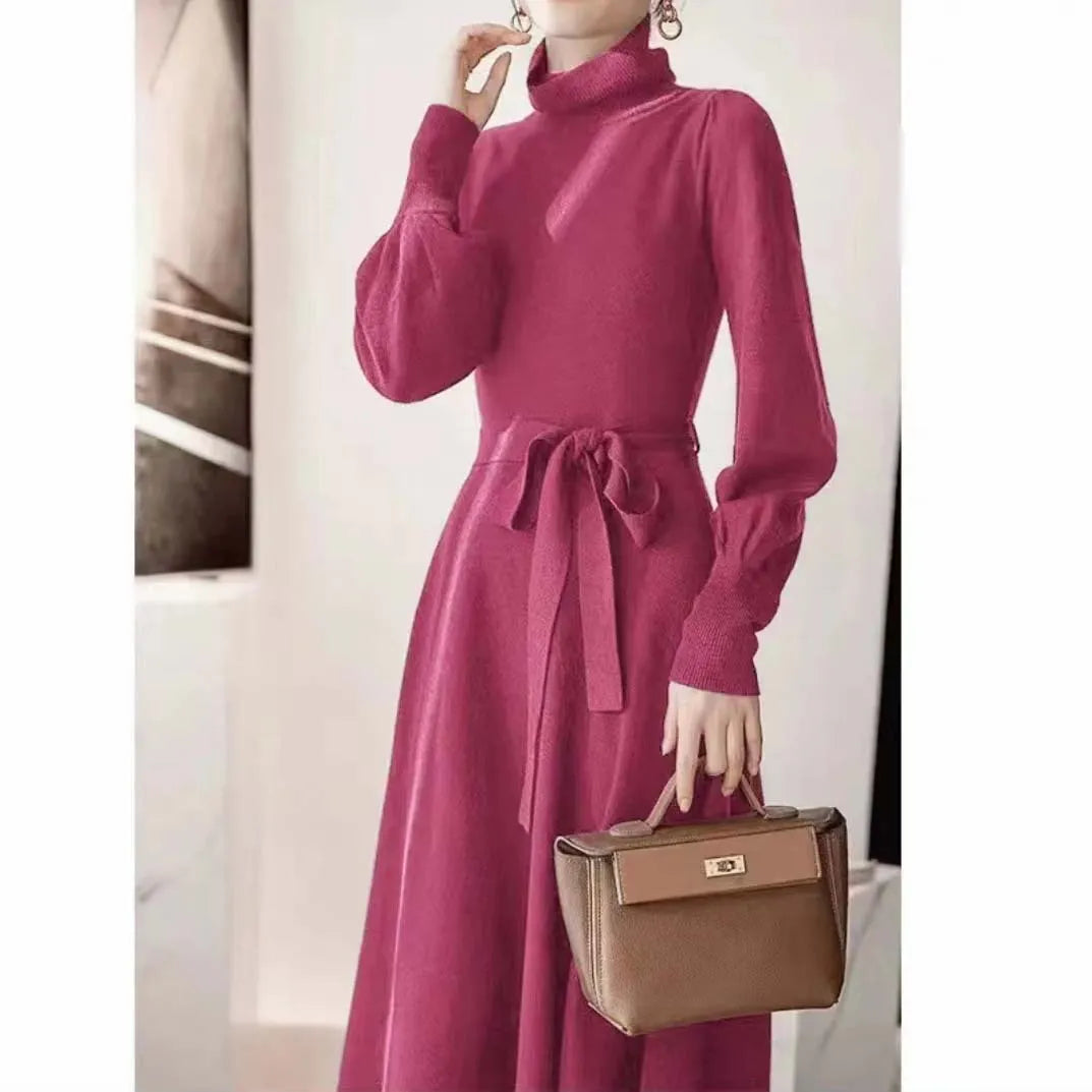 Women's rose red turtleneck long sleeve knit dress with elastic waist and loose mid-length skirt.