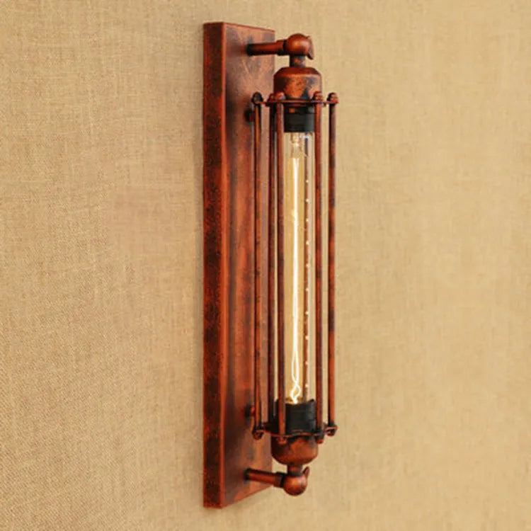 Industrial retro iron wall lamp in antique bronze finish showing flute design.