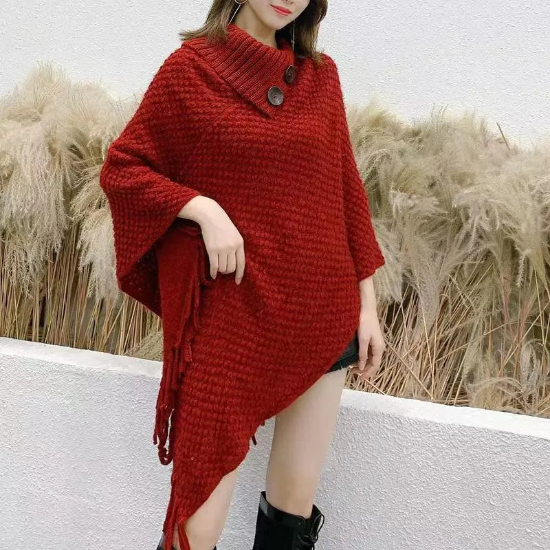 Women's casual plush triangle shawl cape with tassel details in a cashmere and acrylic fabric blend.