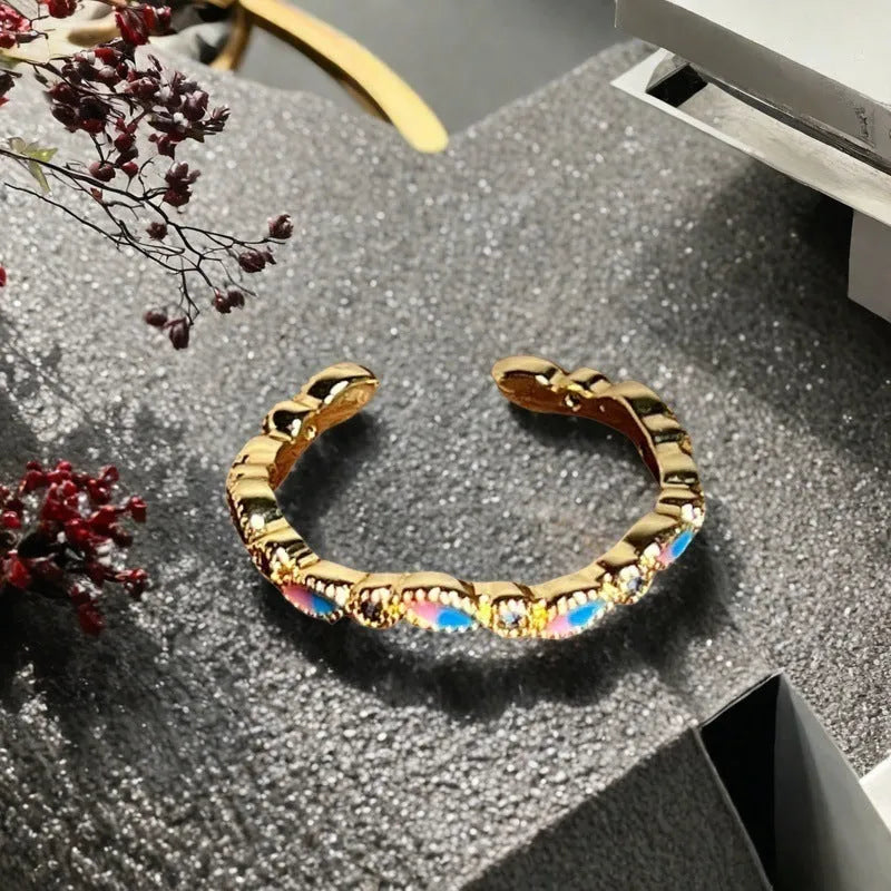 Adjustable vintage oil-dripping gourd copper ring with zircon inlay, showing flower shape in one of six colour options.
