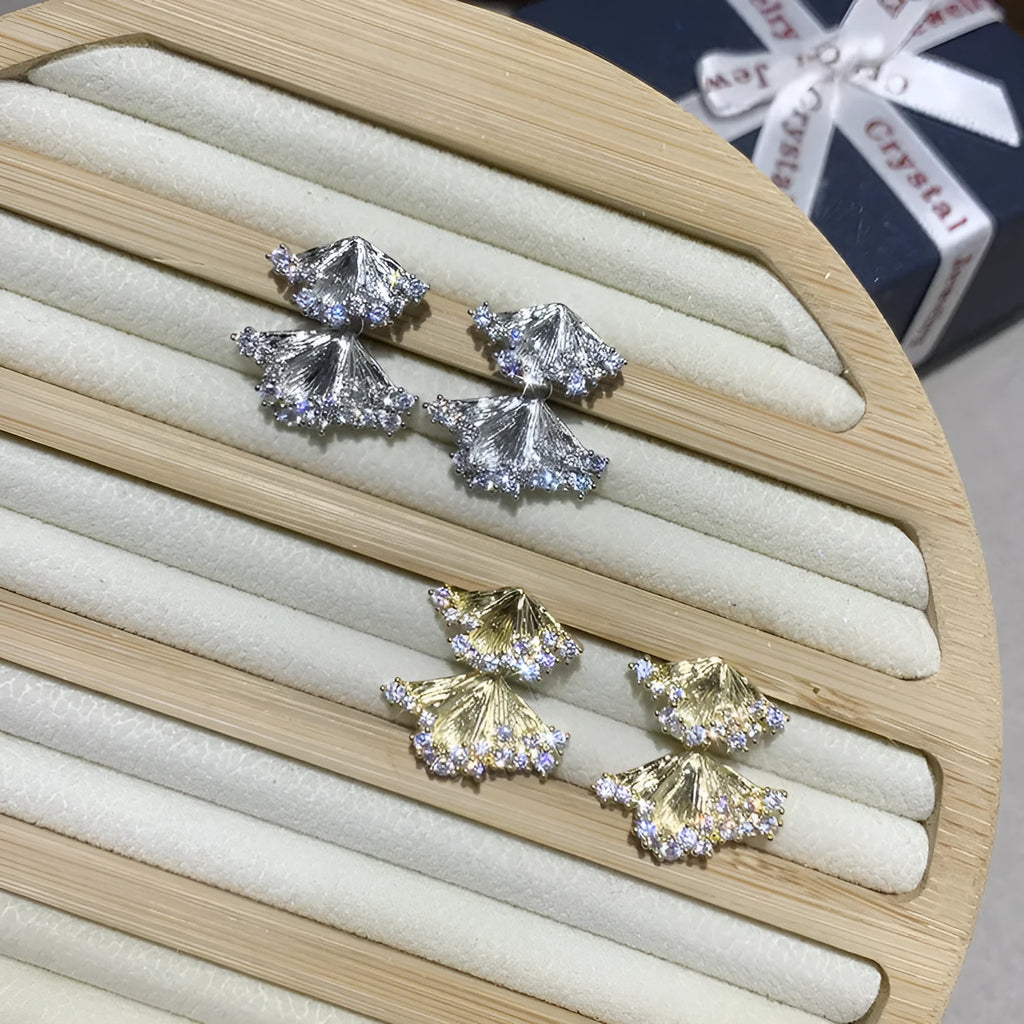Minimalist irregular zircon stud dangle earrings in gold colour on a white background