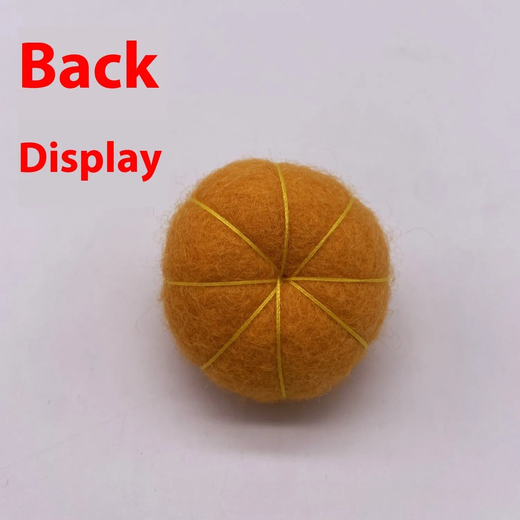 Wool felt pumpkin ornament in assorted colours for dollhouse decoration, approx. 5cm wide.