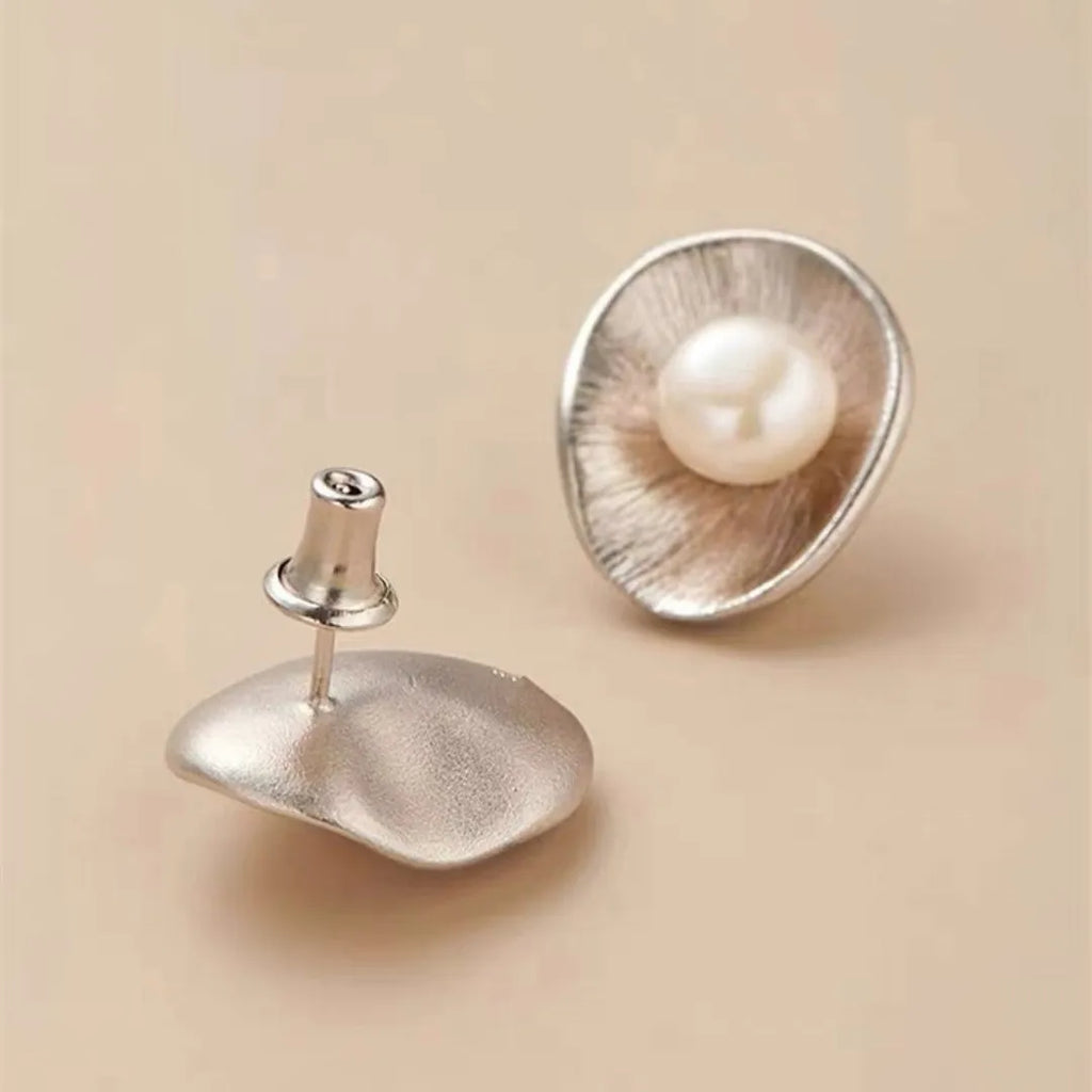 Gold tone geometric pearl stud earrings with sterling silver posts