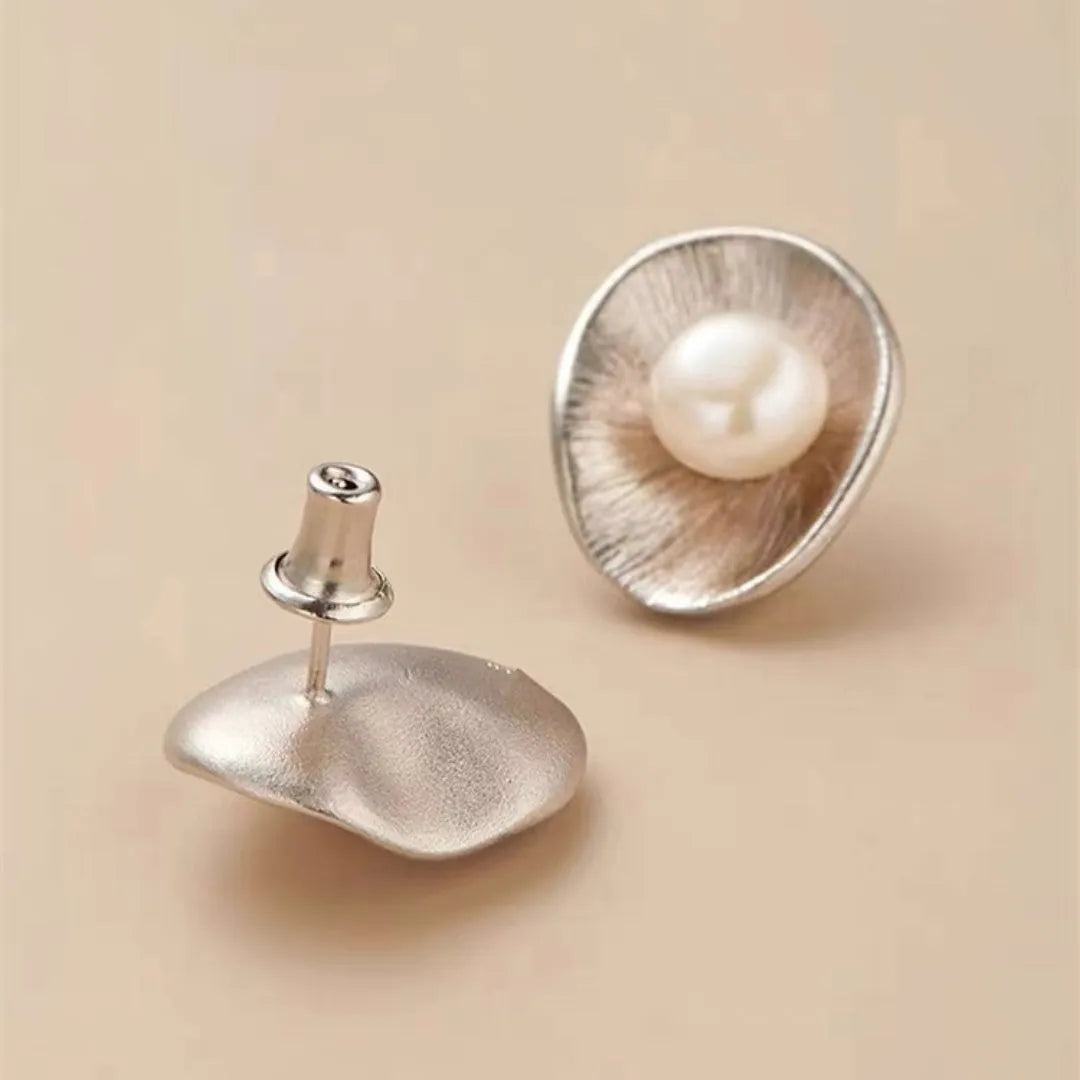 Gold tone geometric pearl stud earrings with sterling silver posts