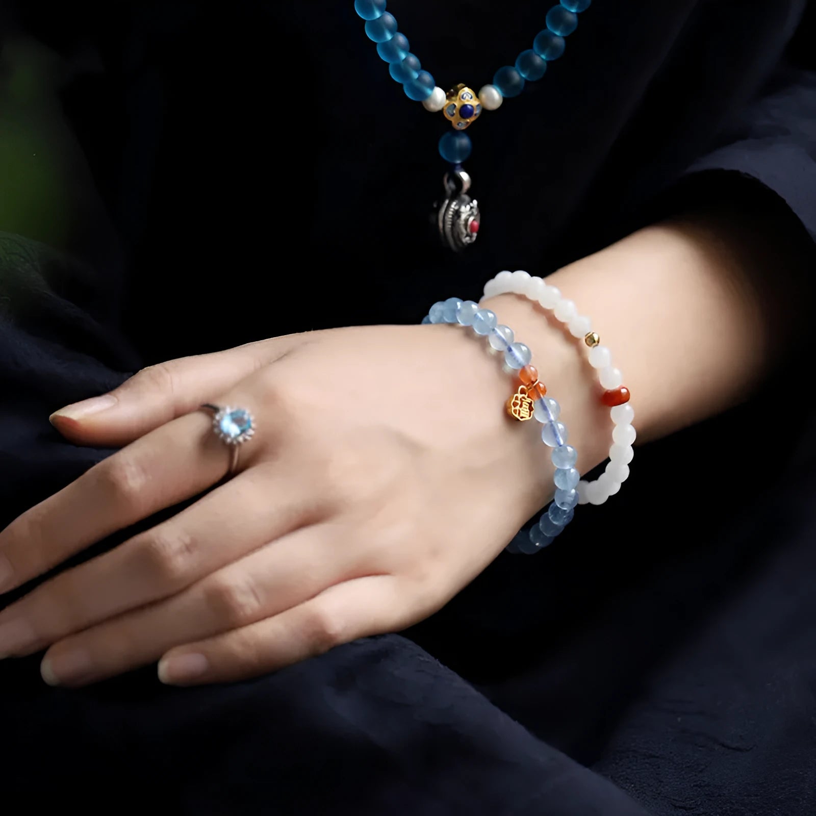 Aquamarine natural crystal bead bracelet with sequin charms on elastic cord