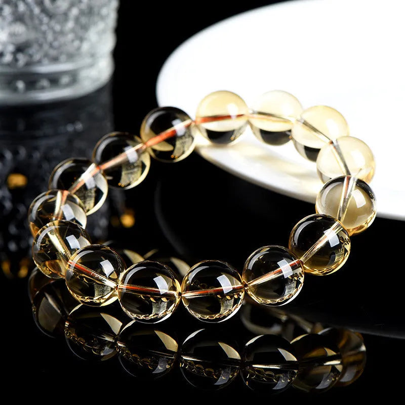 Natural citrine scattered bead bracelet showing polished yellow gemstone beads in an irregular design.