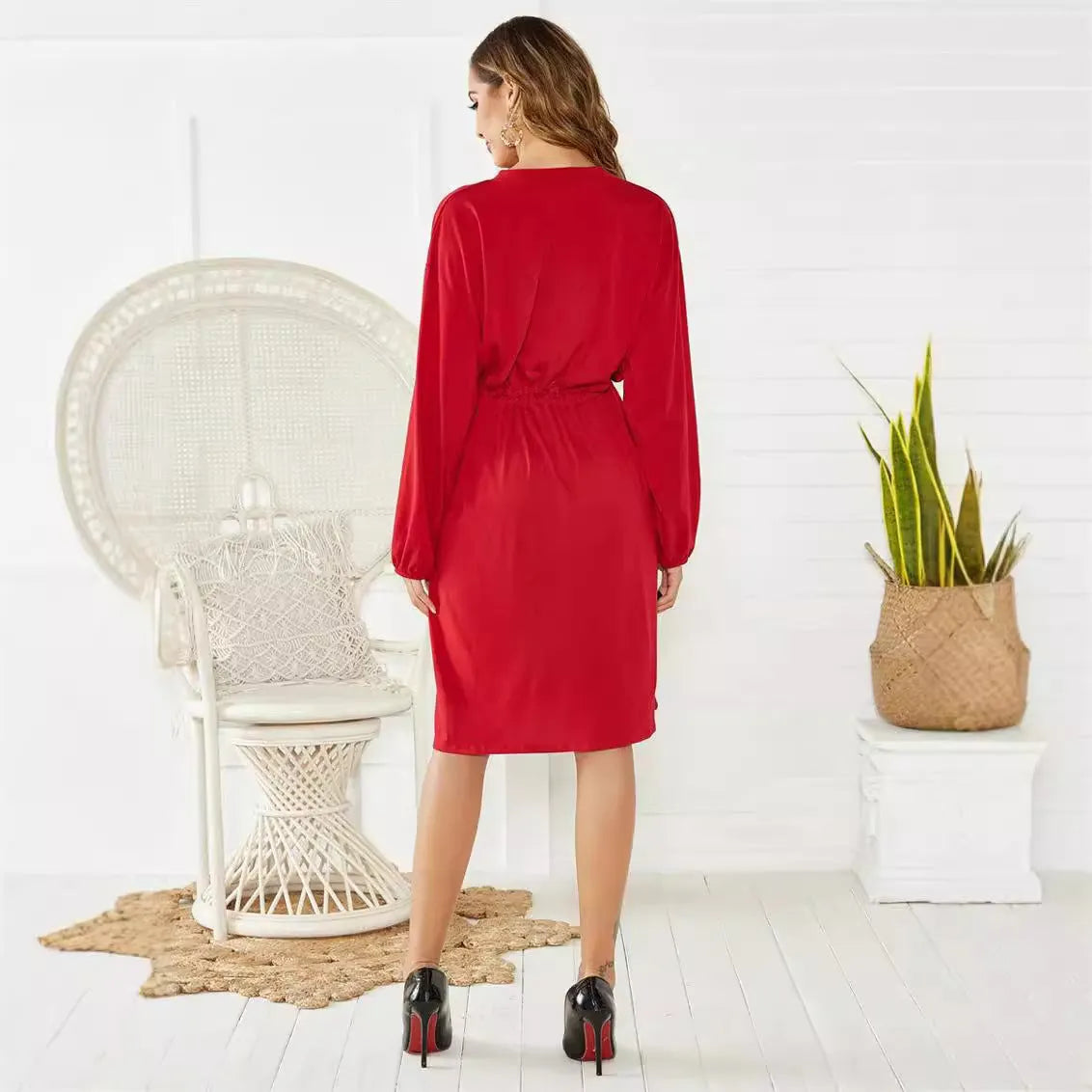 Women's black A-line midi dress with elastic waist and long sleeves