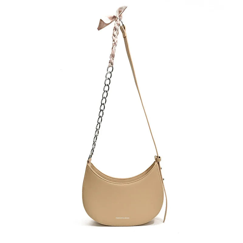 Small PU leather saddle bag on a flat surface, available in black, brown, coffee, green, khaki, and white