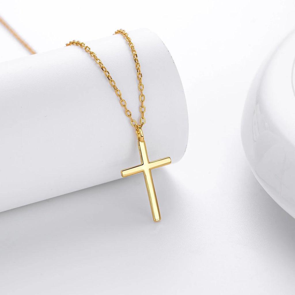 Sterling silver cross necklace with O-shaped chain in gold plating on display