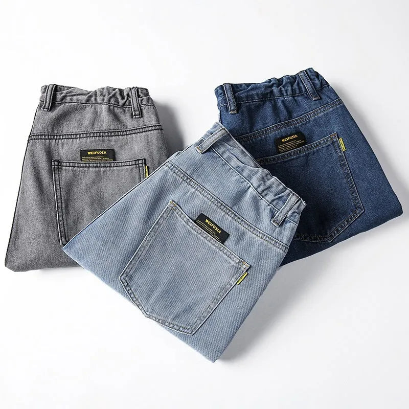 Men's loose straight jeans in dark blue colour showing mid waist and straight leg design
