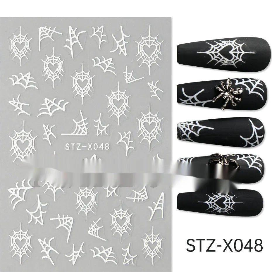 Plastic sheet of black, silver, and cartoon design nail art stickers for DIY manicures.