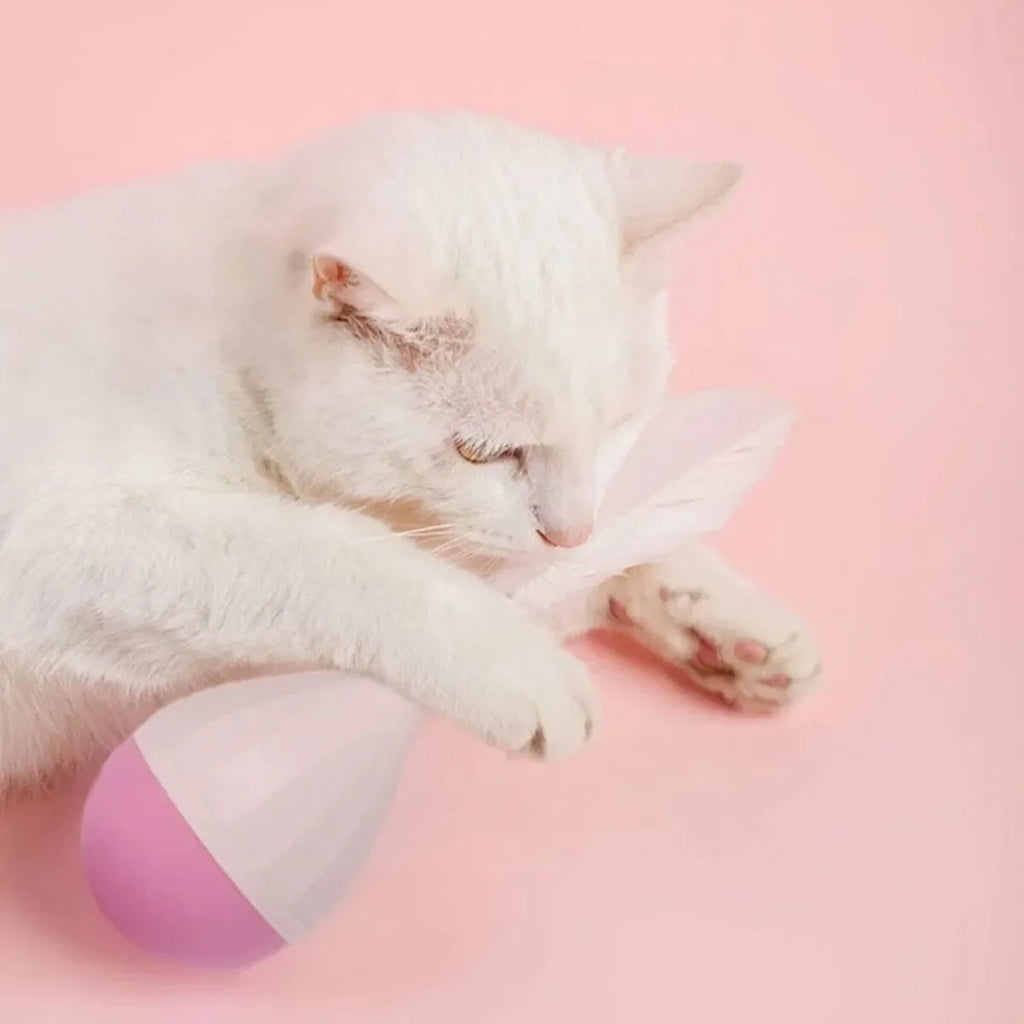 Green and pink feather tumbler cat toy with tease ball on stick