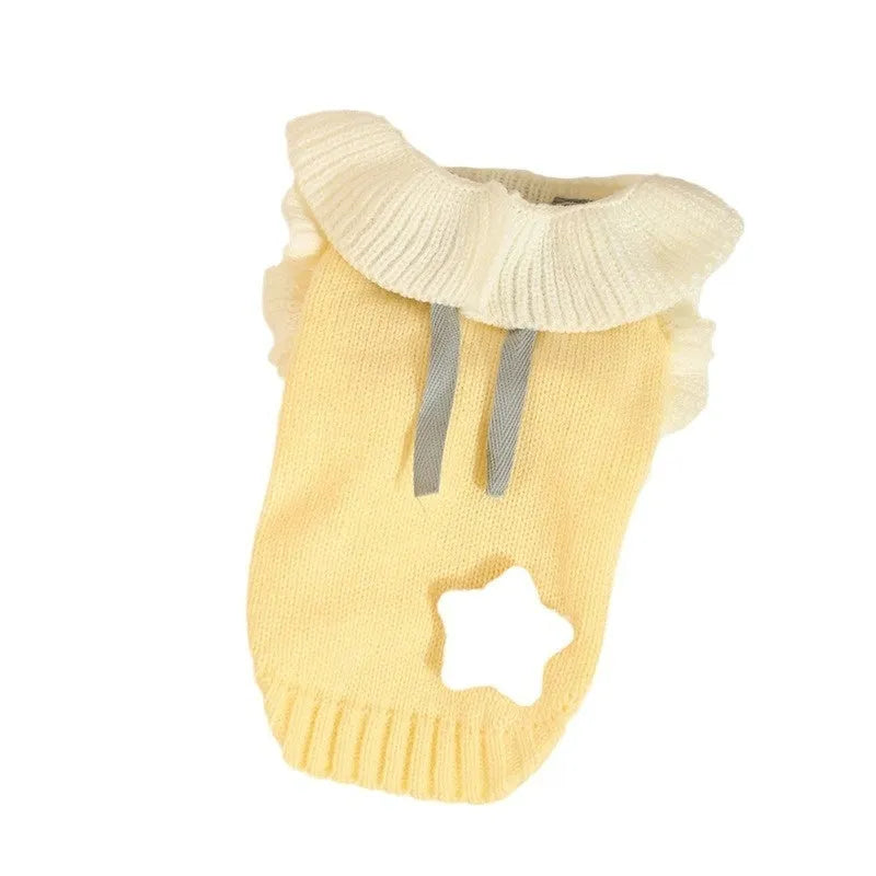 Yellow acrylic dog sweater shown on small breed pet with chest measurement guide