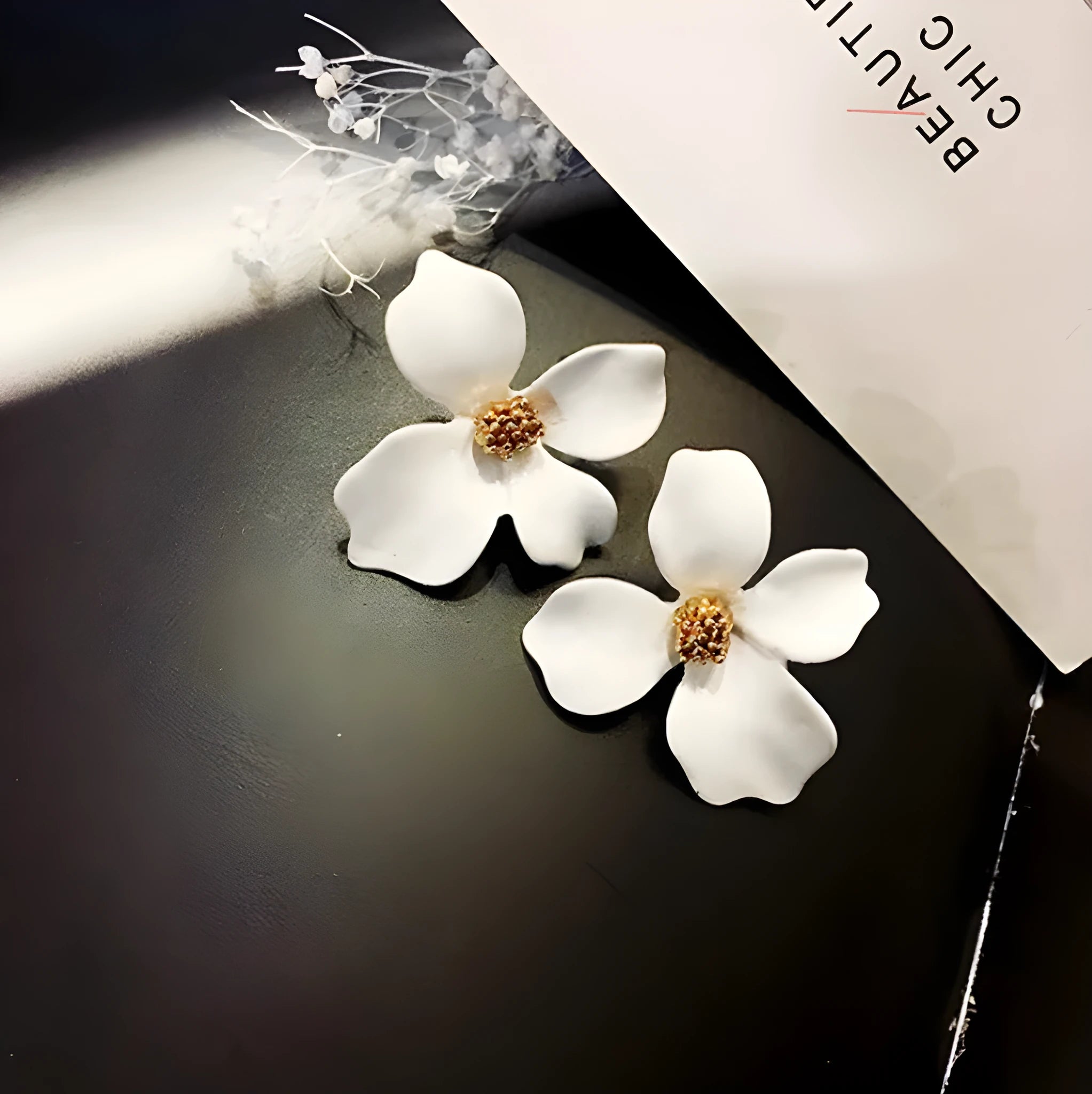 Flower stud earrings for women in white or pink with electroplated alloy construction