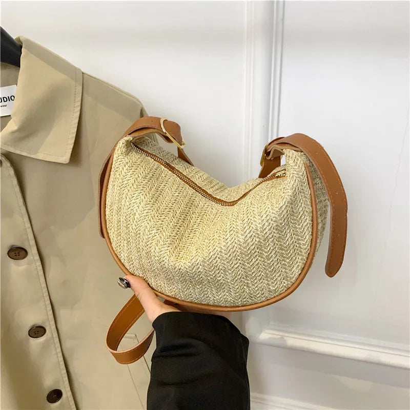 Women's straw woven crossbody bag with internal phone and document pockets in corrugated finish
