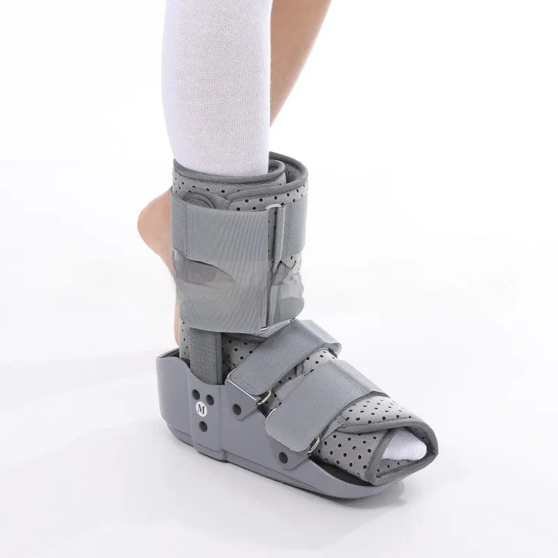 Grey Achilles tendon rehabilitation boot with aluminium struts and adjustable straps.