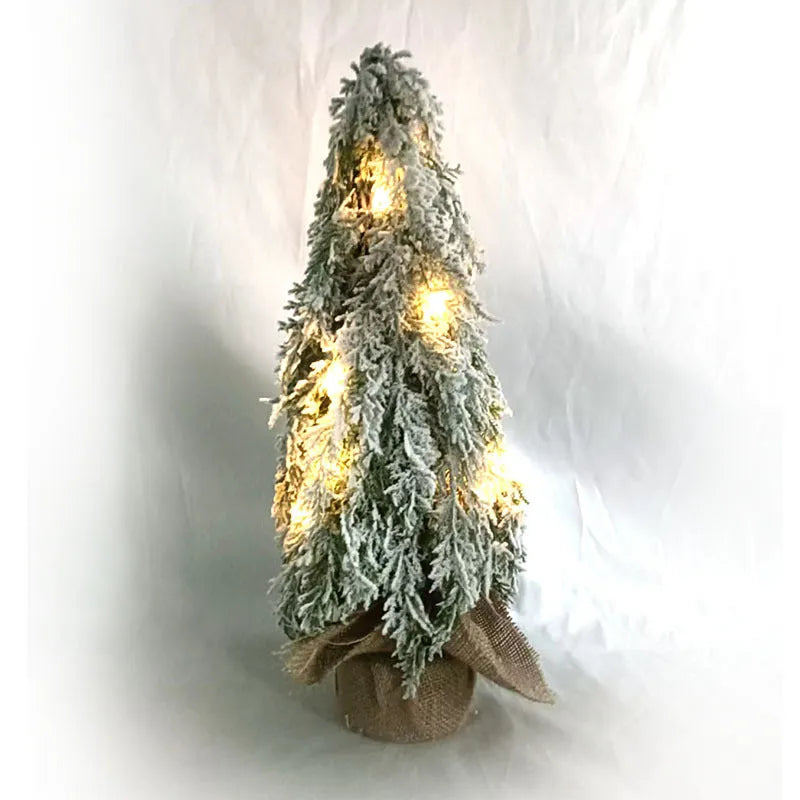 24-inch plastic Christmas tree with PE simulation snow spray effect and built-in lights on desktop