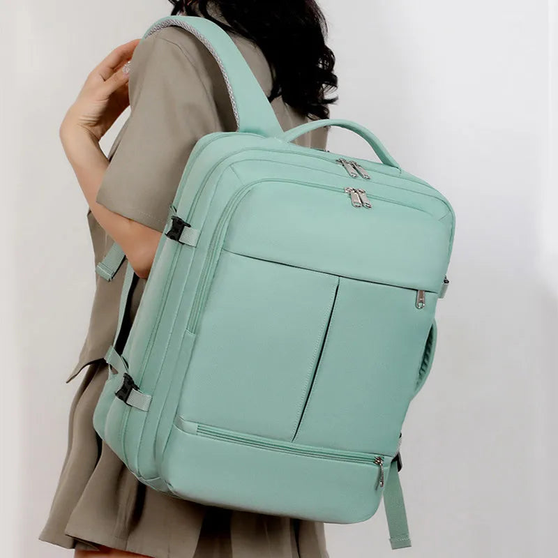 Waterproof Oxford cloth laptop backpack in multiple colours, showing front pockets and 15.6 inch laptop compartment.