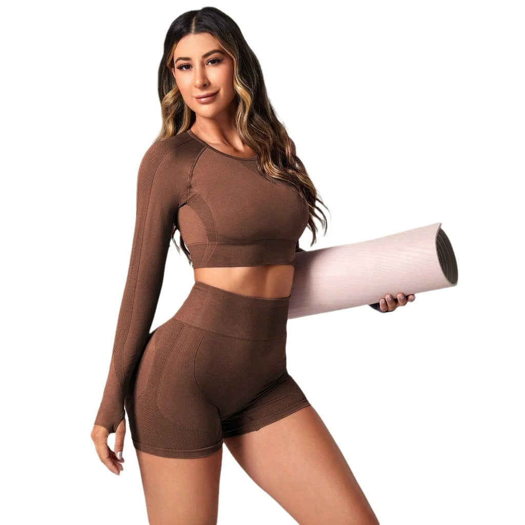 Women's black yoga suit with high waist hip lift design and long sleeves for fitness activities
