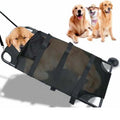 Black foldable aluminium alloy pet stretcher for large dogs, shown in emergency transport use.
