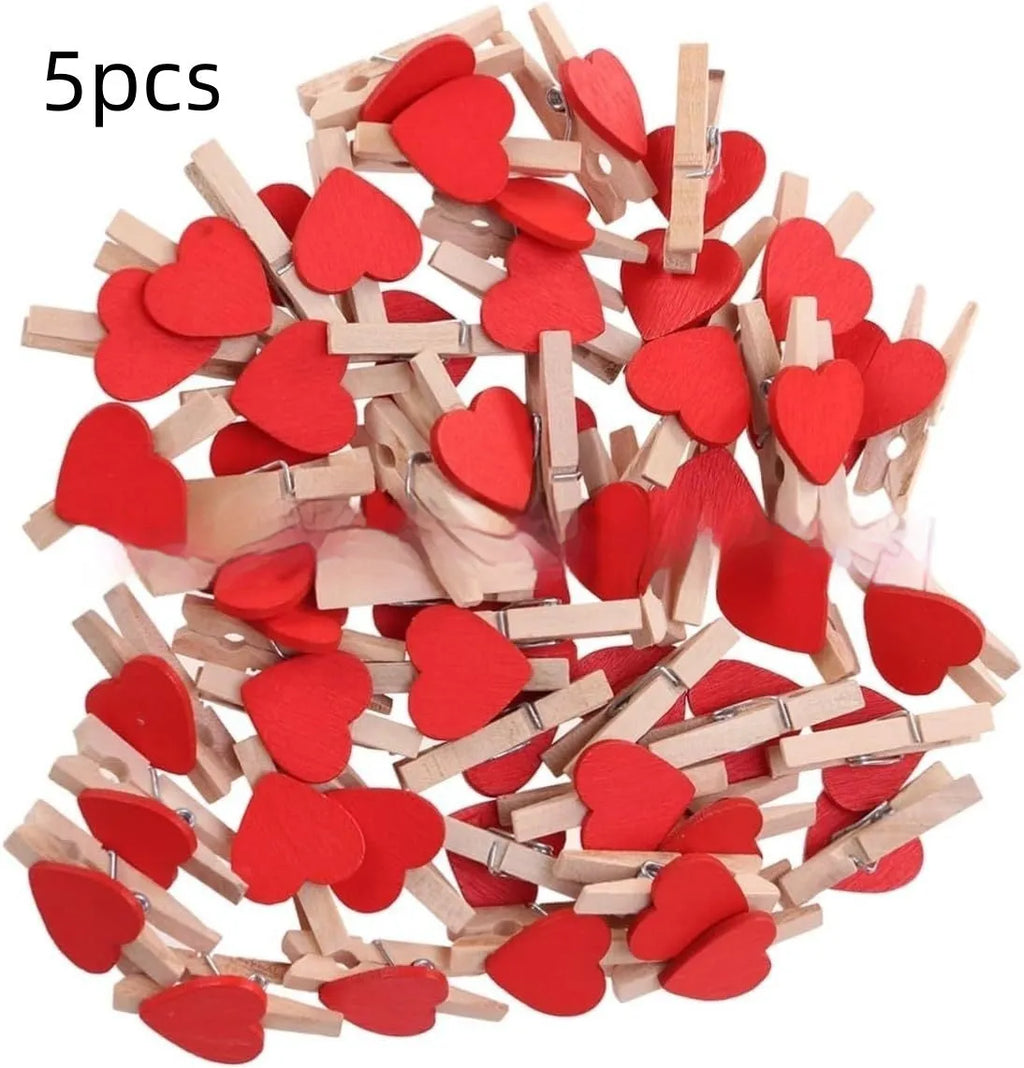 Five solid wood heart-shaped clips in different colours showing handmade construction details