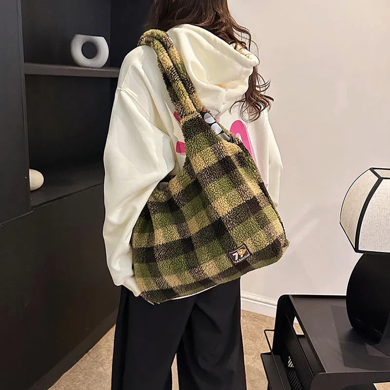 Women's plaid crossbody shoulder bag in soft plush fabric showing horizontal square shape and large capacity