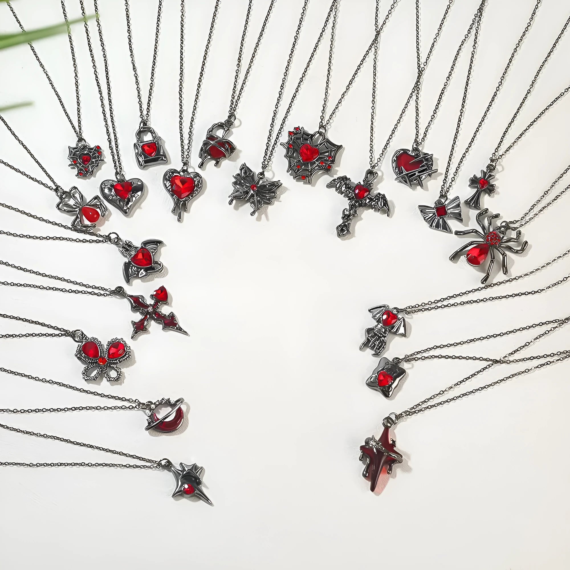 Gothic Halloween necklace with spider and bat alloy pendant on a chain.