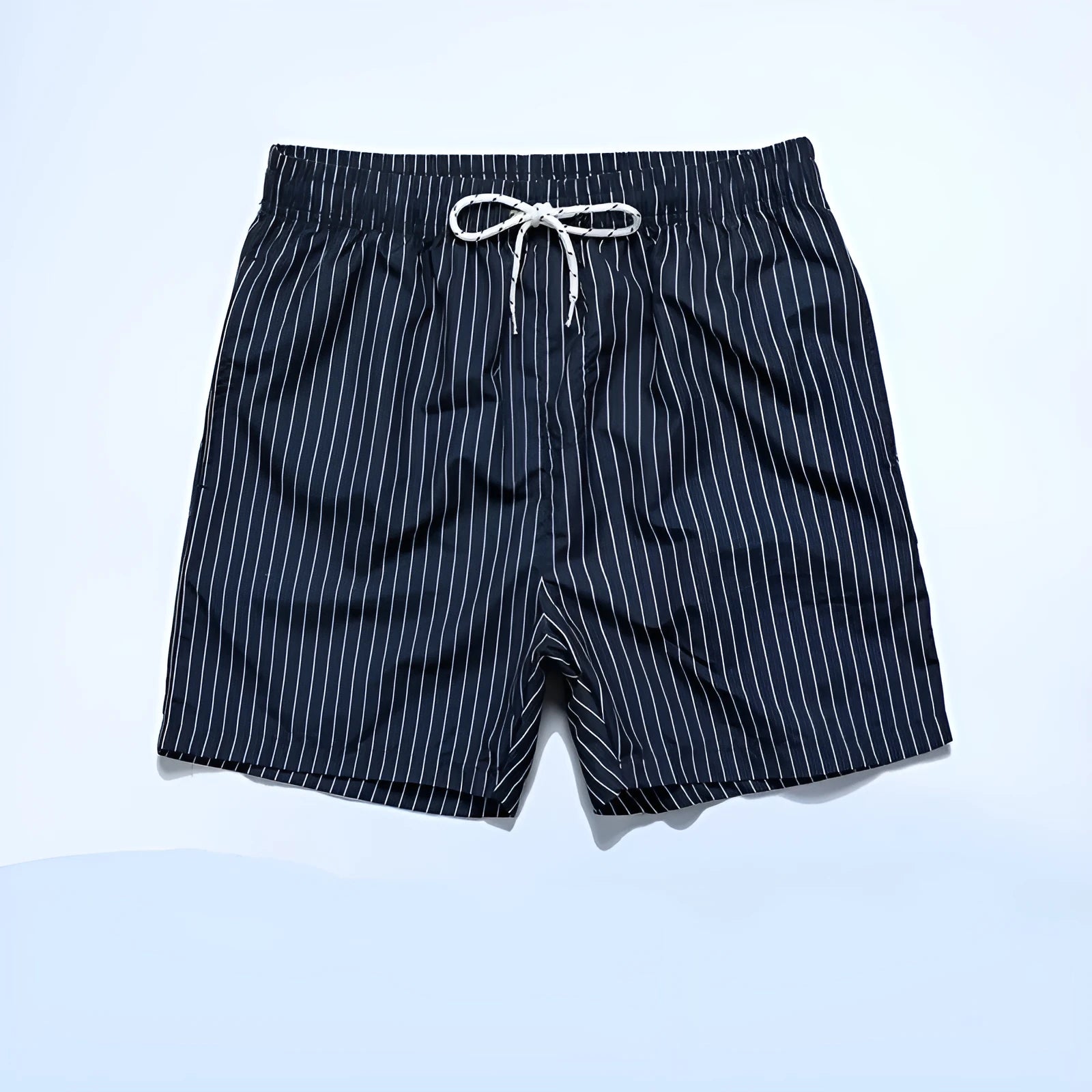Navy blue and grey striped beach shorts with a straight leg opening on a mannequin.