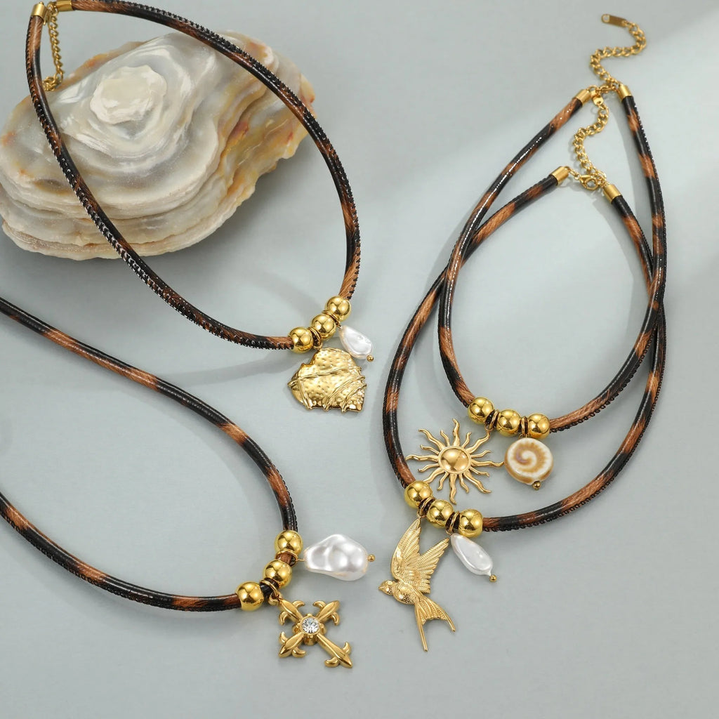 Geometric leopard print pendant on a gold-toned stainless steel necklace for women.