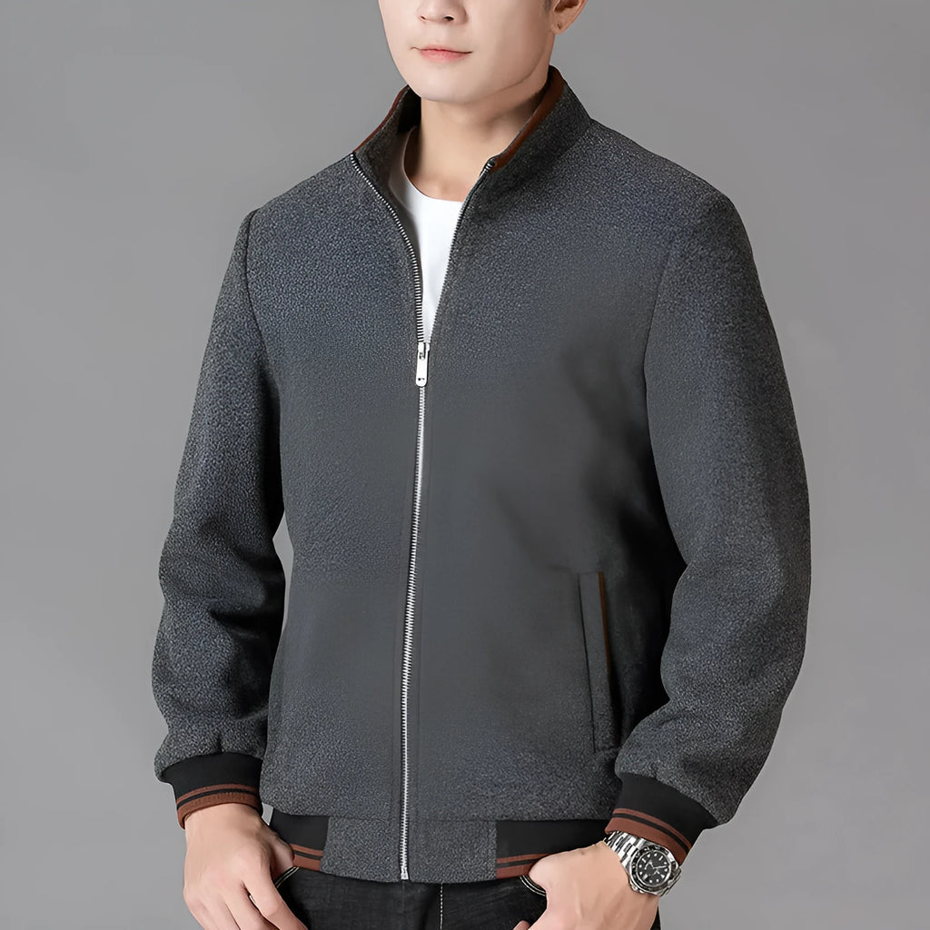 Men's grey sports-style fleece jacket with long sleeves and a stick pocket on the arm.