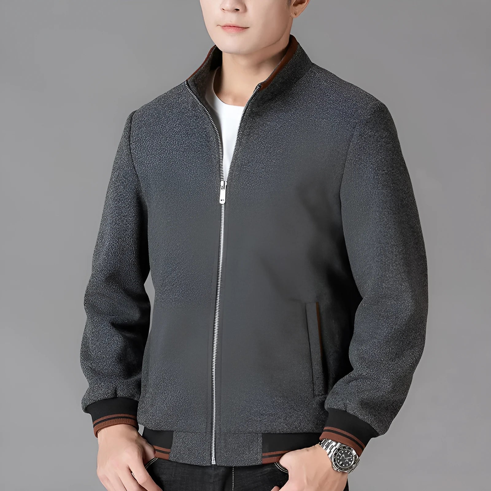 Men's grey sports-style fleece jacket with long sleeves and a stick pocket on the arm.