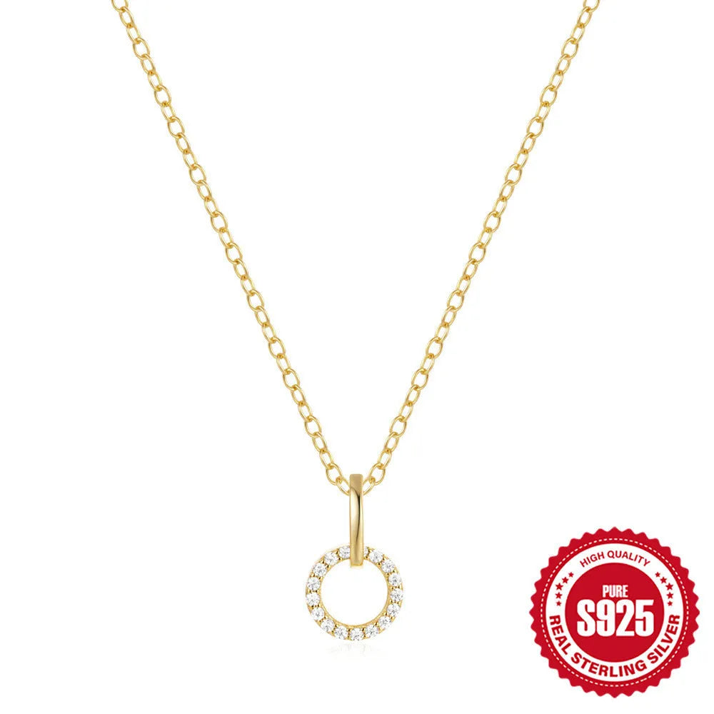 Gold-coloured geometric pendant on adjustable sterling silver clavicle chain necklace