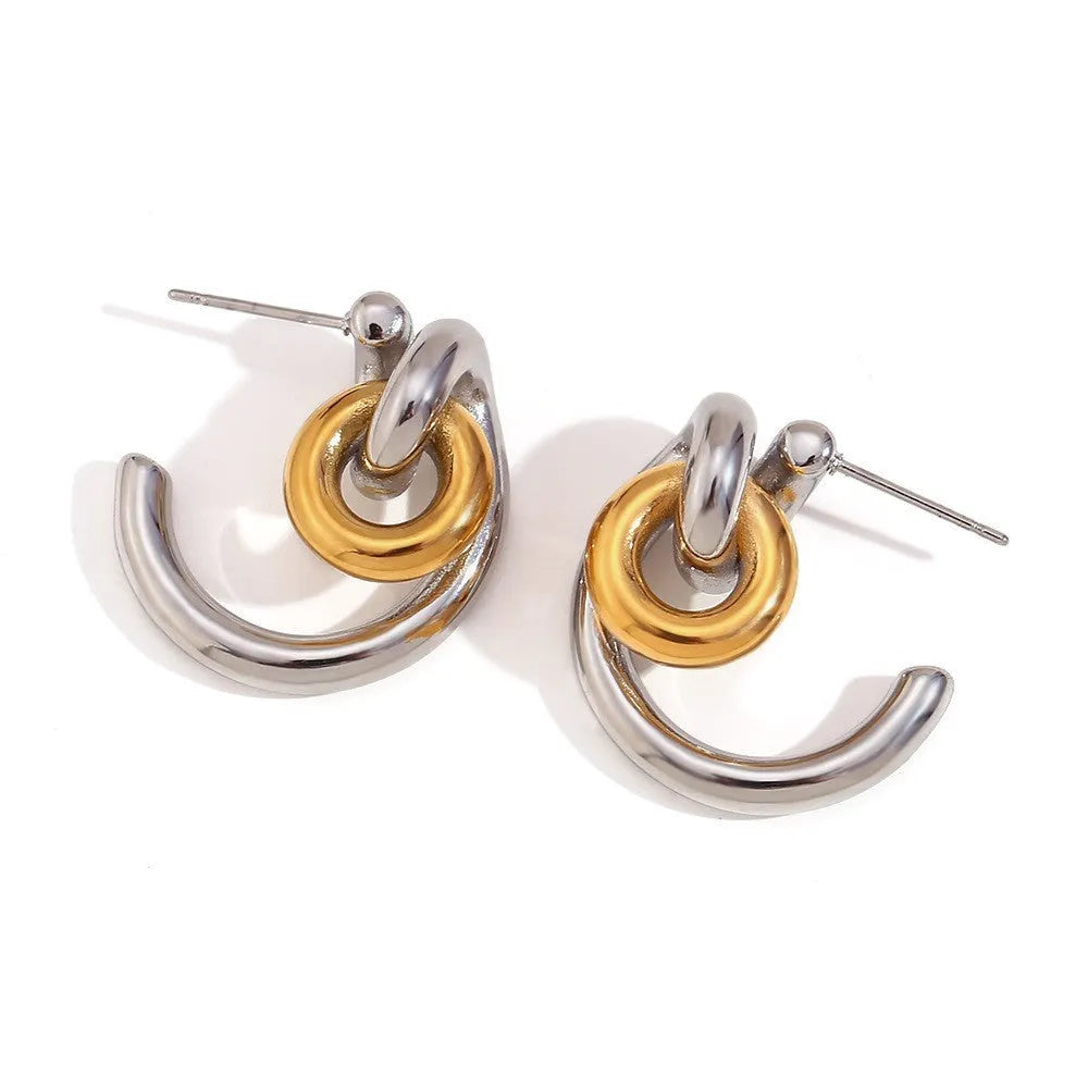 Women's geometric gold stainless steel jewellery set showing earrings, bracelet and necklace