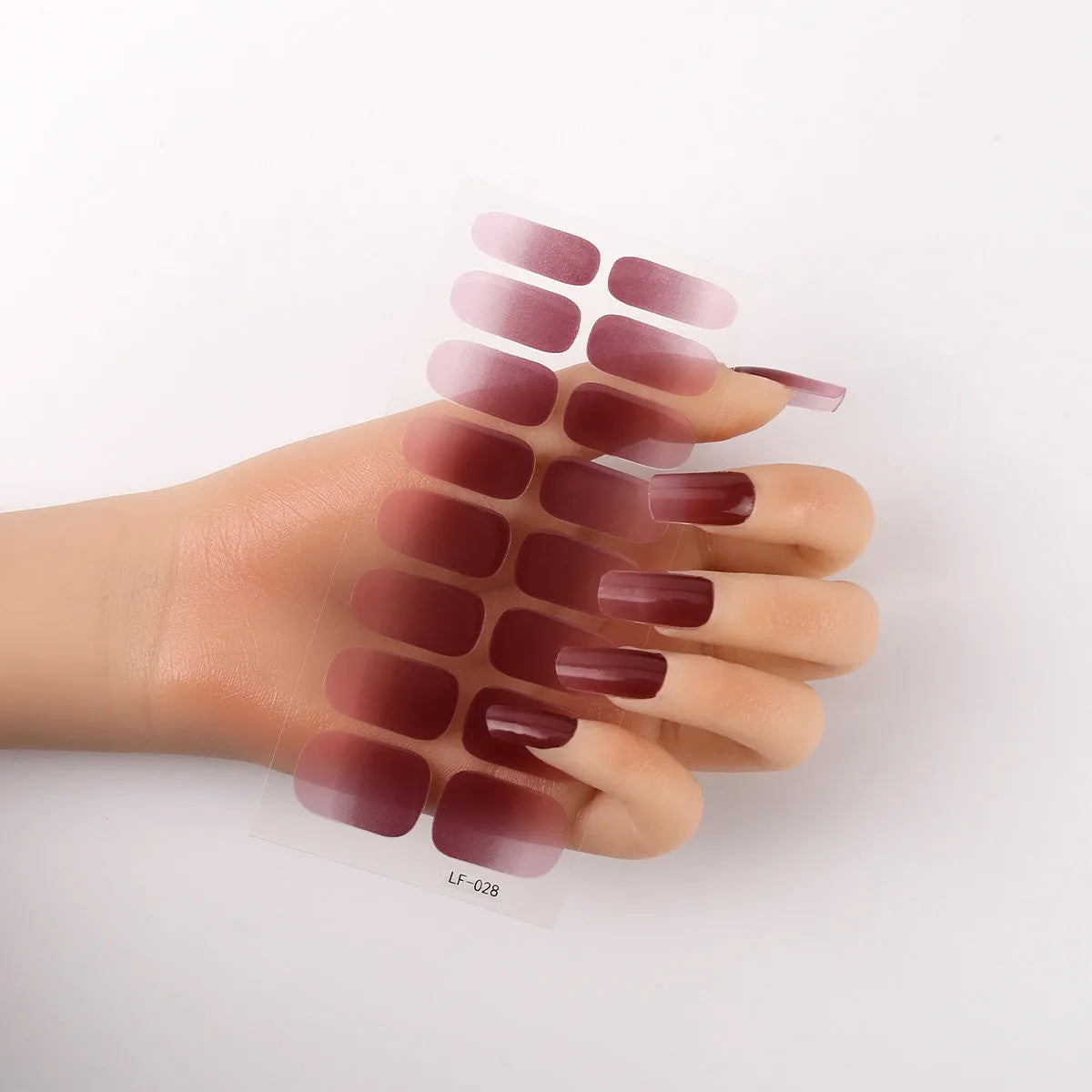 Full nail art sticker sheet showing 16 different solid colour designs including European simple nails and floral patterns