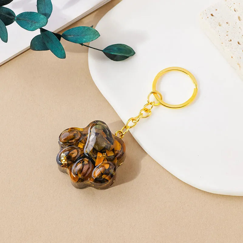 Small natural crystal cat's paw shaped pendant on a metal keyring, available in various crystal colours.