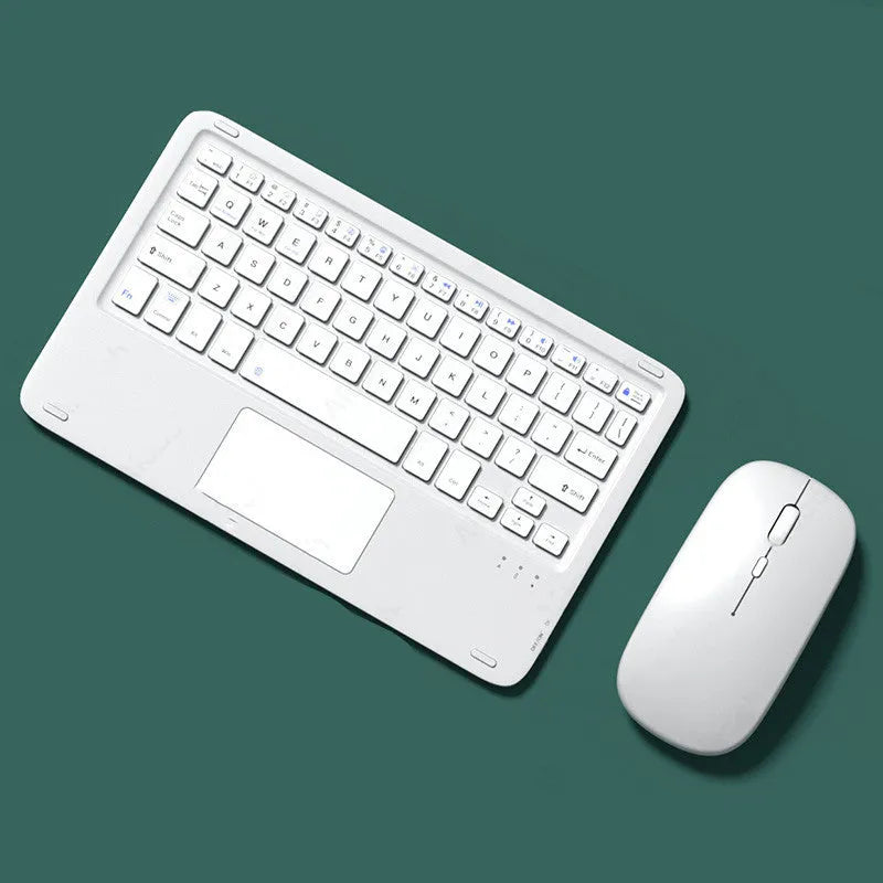 Pink wireless keyboard and mouse combo with slim touch keyboard and Bluetooth connectivity on wooden desk