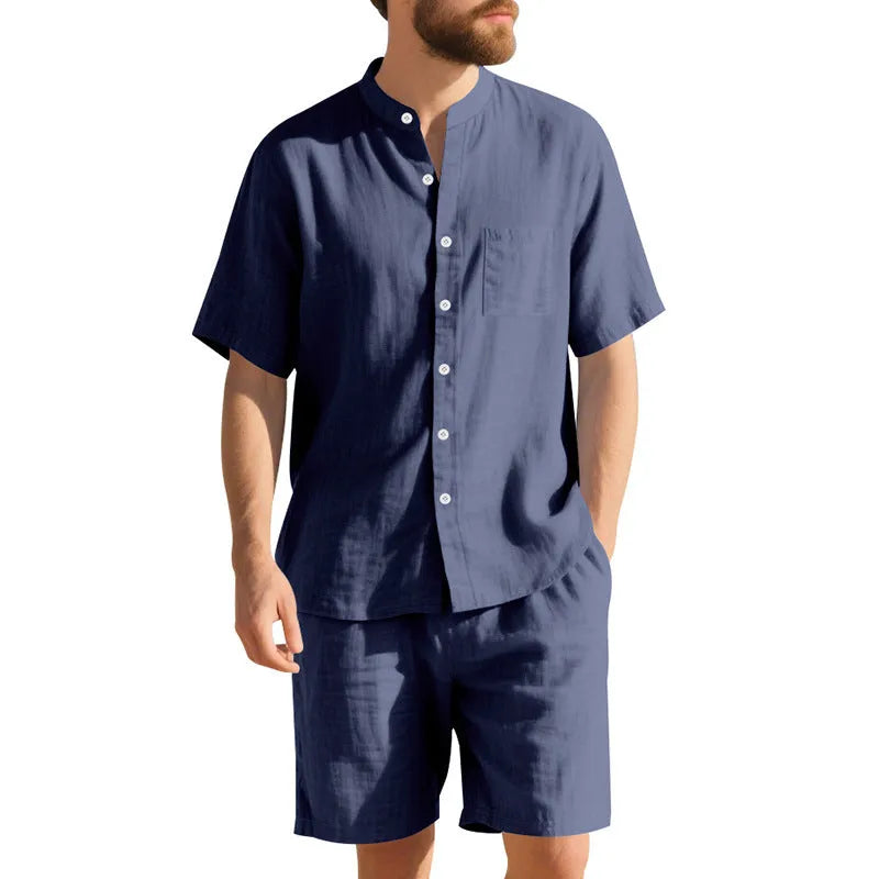Men's light blue linen blend summer suit with henry collar, short sleeves, and matching shorts