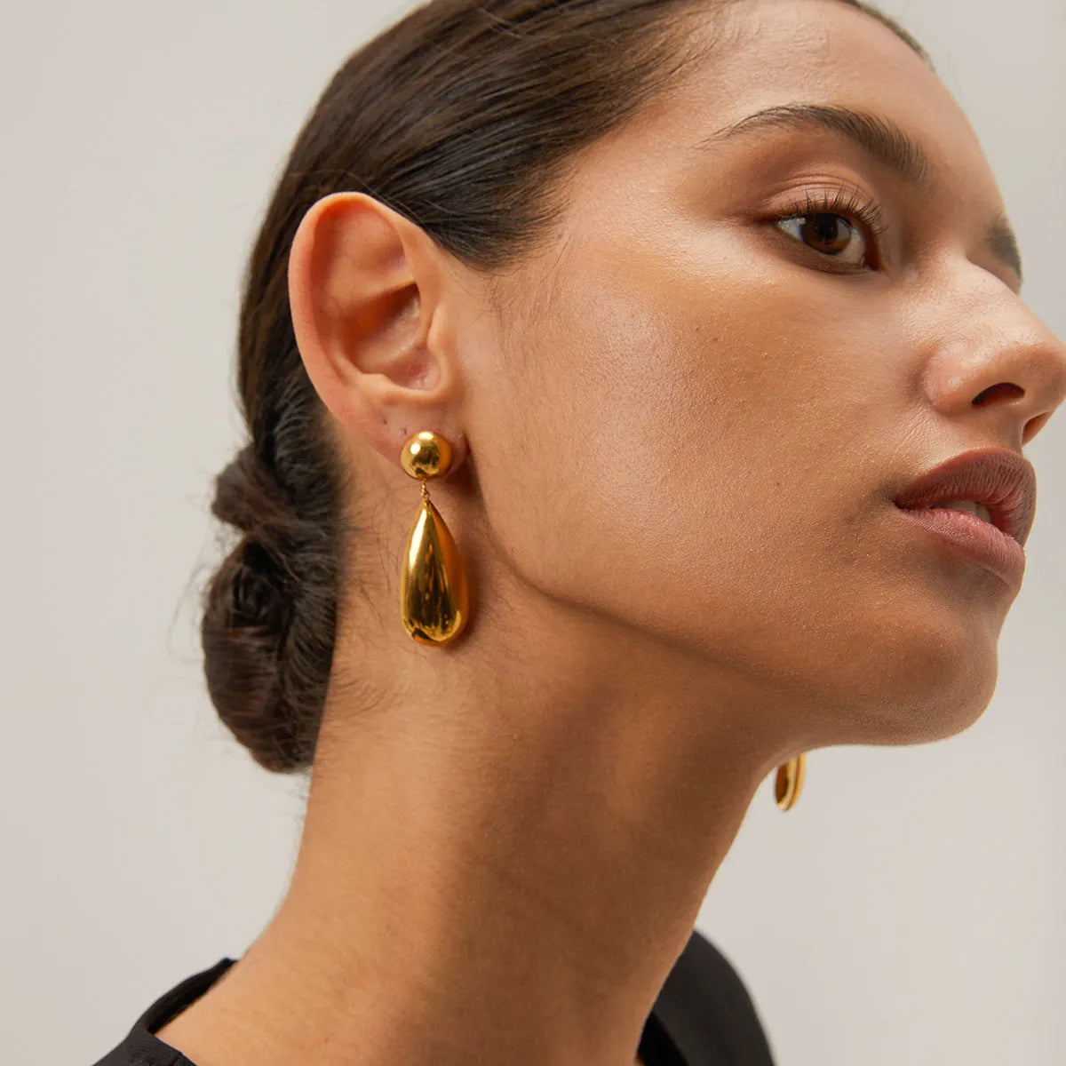 Gold stainless steel water drop earrings with geometric hemisphere pendants for women
