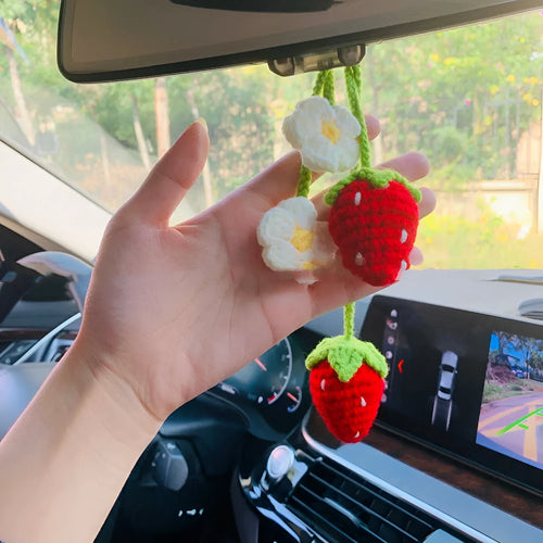 Handmade woven strawberry-shaped car hanging ornament made from cotton and hemp yarn with a Lily of the Valley hook.