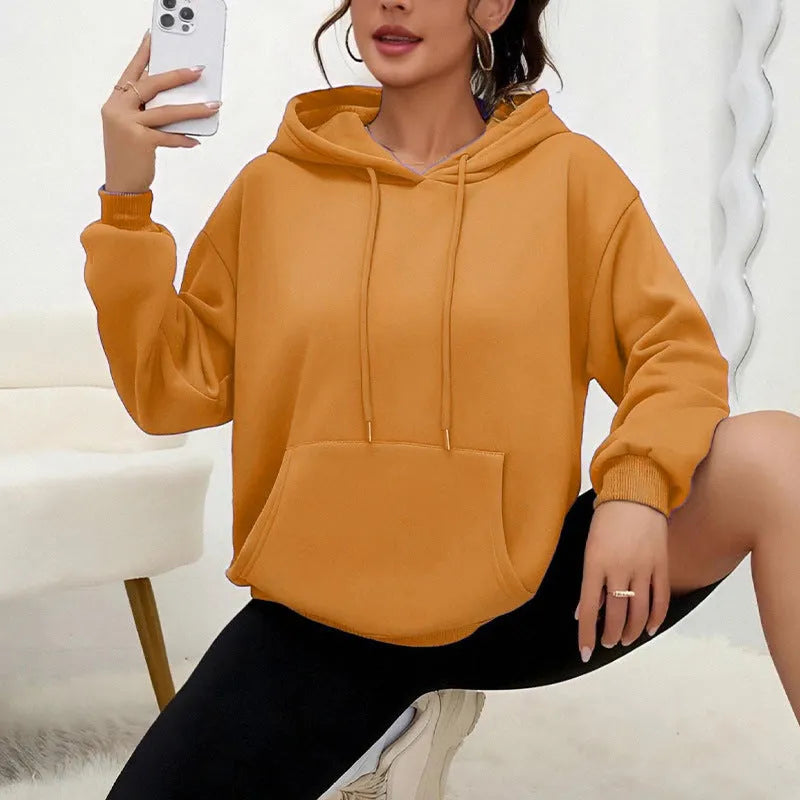Women's loose fit grey drawstring hood sweatshirt with front pockets, long sleeves