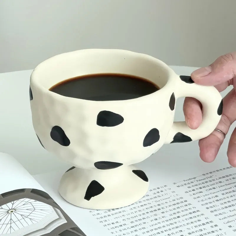 Hand-pinched irregular ceramic mug with solid colour design, approximately 14.5cm tall