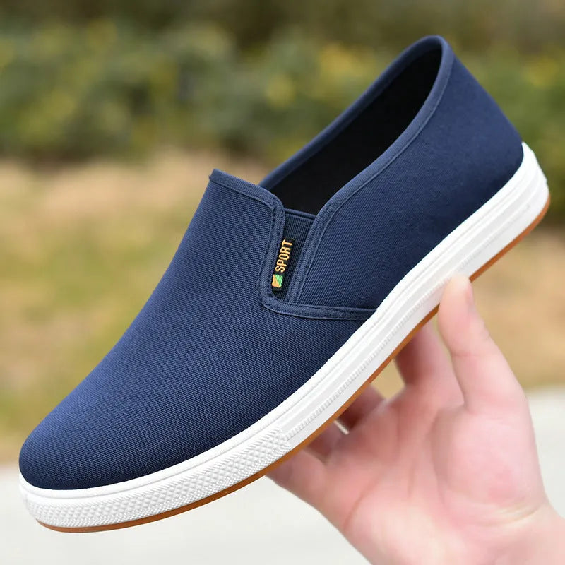 Men's black and blue canvas slip-on shoes with round toe design and composite soles
