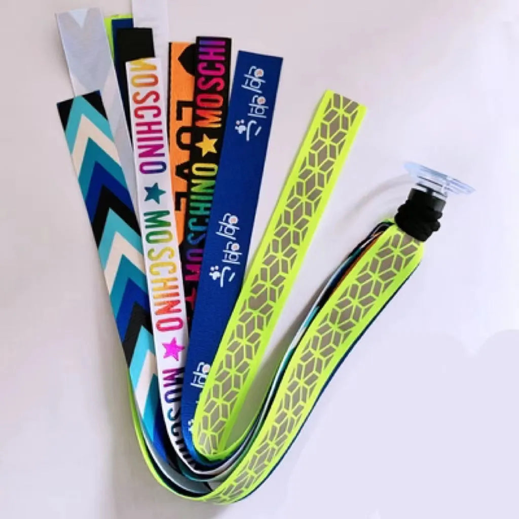 Close-up of a colourful decorative ribbon streamer attached to a child's helmet for roller skating or skiing.