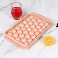 Blue silicone ice cube tray with lid showing 33 round grids, measuring 24x14x3cm