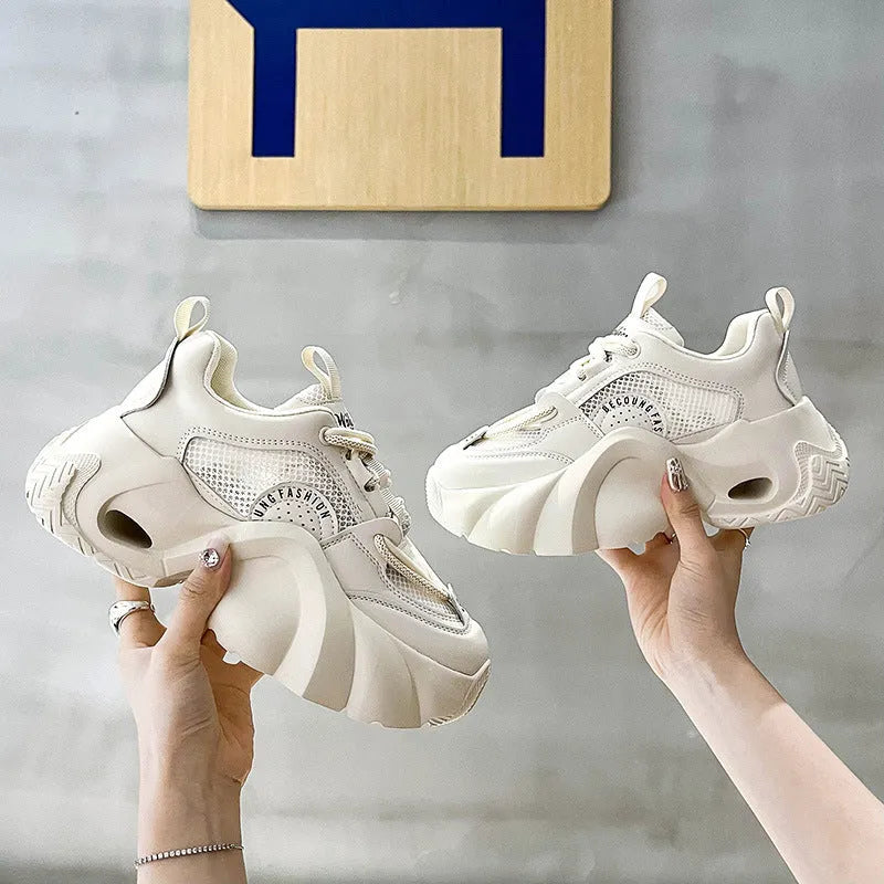 Women's beige sneakers with cross shoulder straps and a thick mid-heel sole
