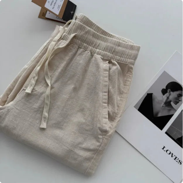 Men's loose straight casual pants in beige colour with elasticated drawstring waistband
